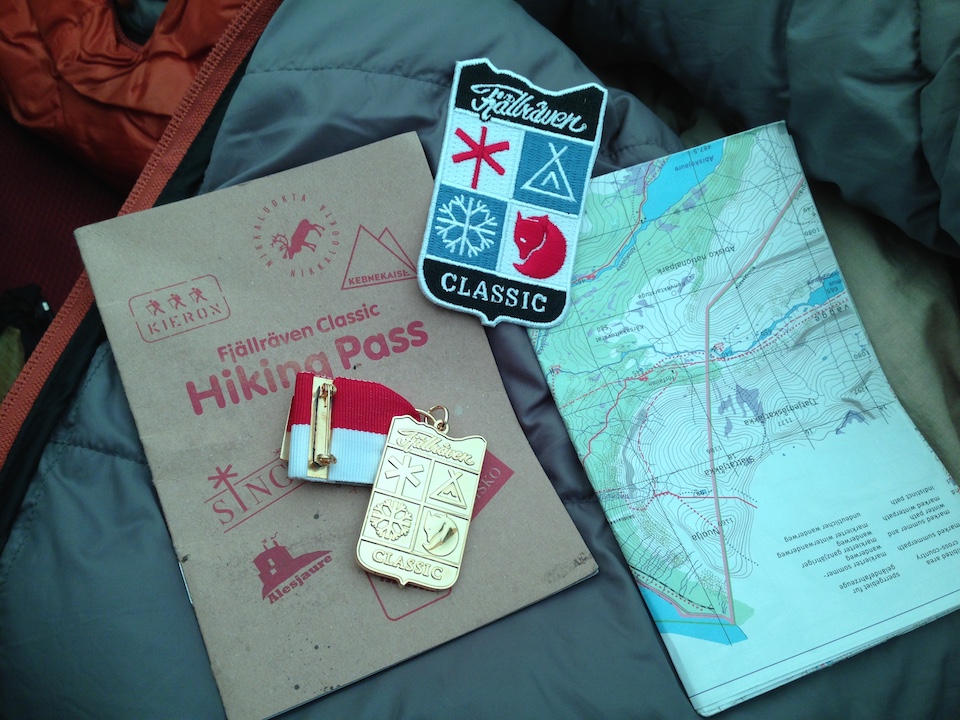 The medal received for completing the Fjällräven Classic, and a small badge